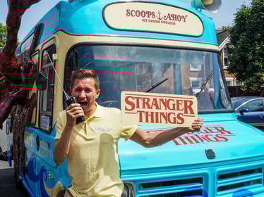 A man posing for the Stranger Things ice cream promotional campaign.