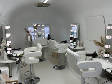 A mobile pamper parlour with soft lighting, used as part of a unique beauty experience. 