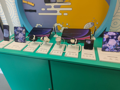 Samsung's tech showcase bus, with pads and phones visible - installation by Promohire.