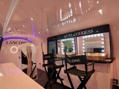 Inside Lancome's Airstream trailer, customised with seating and a photo booth.