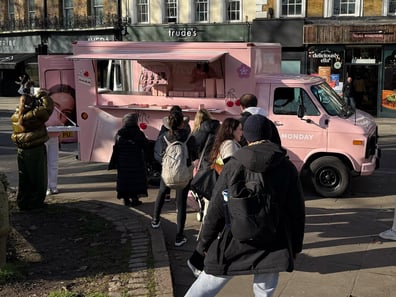 A line of people line up to visit the Monday American ambulance in the UK.