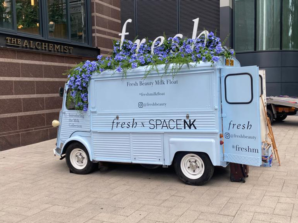 A light blue H-Van, hired from Promohire, for Fresh and SPACENK - with roof signage.