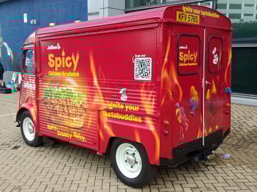 A red, branded Citroen H-Van classic