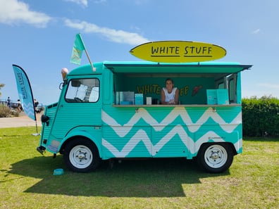 A woman in the White Stuff Citroen sampling H-Van