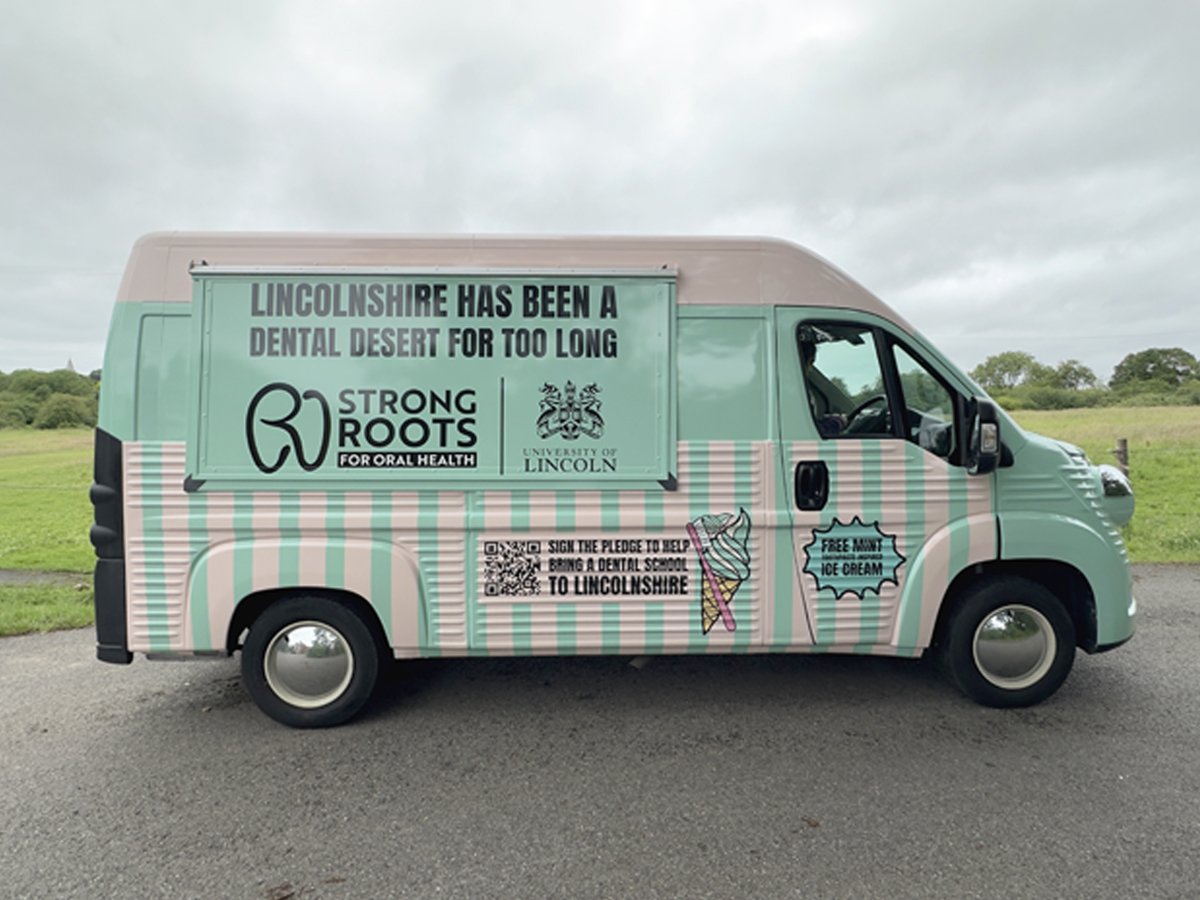 Lincoln University's Strong Roots H-Van Relay, with a QR code and vehicle branding.