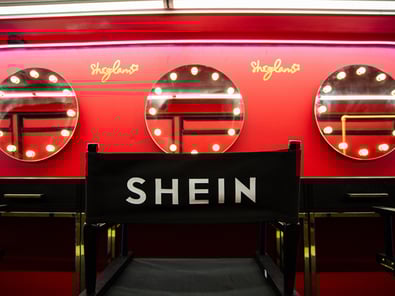 SHEglam's red beauty event, inside a double-decker bus.