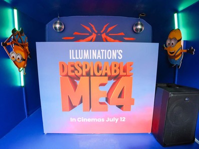 A DJ booth for Despicable Me, housed within Universal's immersive bus experience for an influencer event.