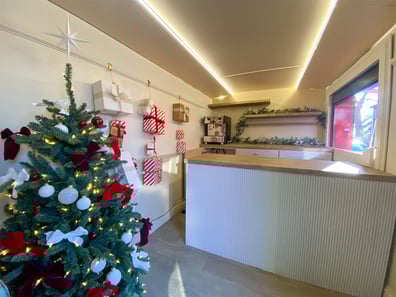 Inside the Yankee Candle bus with a Christmas tree as part of a brand campaign.