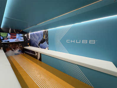 CHUBB branding inside a double-decker event bus.