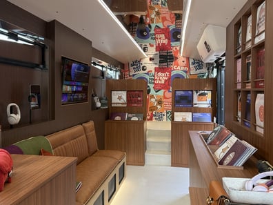 The lounge inside the Spotify and COACH Tabby Tour promotional bus hire.