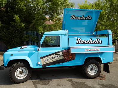 The blue custom Land Rover Defender, with a lift-up roof for sampling campaigns.