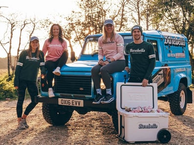 A team of staff for Barebells on a Land Rover Defender