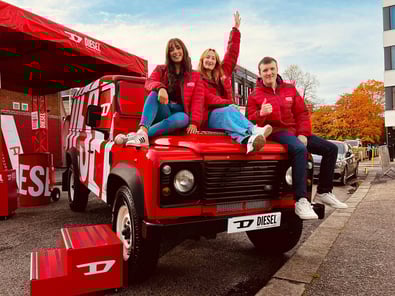 Staff sit on Diesel's Land Rover Defender hire.