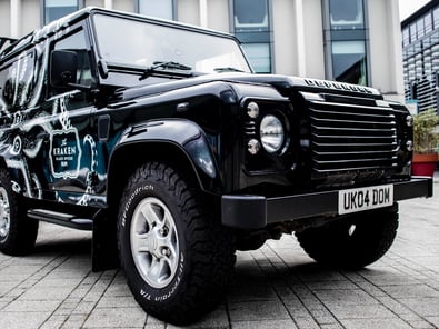 A classic Land Rover Defender, wrapped in black for Kraken, and delivered by Promohire for a city-based brand activation.