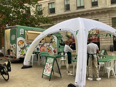 The Lacto modern sampling van, with seating area