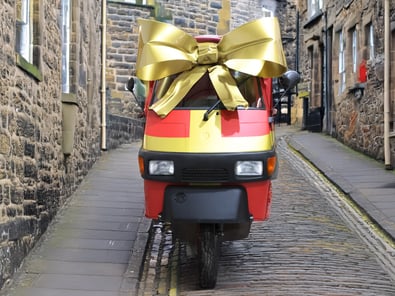SHEIN's sampling event kicks off with a vehicle in a gold bow.