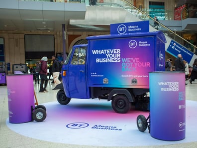 The BT Piaggio Ape, indoors at a train station for a brand activation.