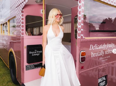 A model poses with the Brutal Fruit promotional Routemaster vehicle
