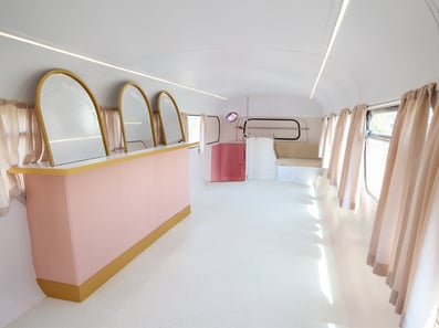 An immersive space into the Brutal Fruit Cider bus, customised by Promohire.