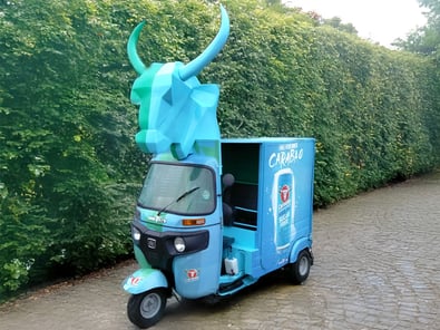 The blue Barabao tuk tuk hire, with the bull's head on top
