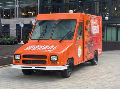 An orange US postal van Utilimaster for Wasabi, from Promohire