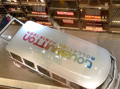 Above the Louis Vuitton branded vehicle, looking down.