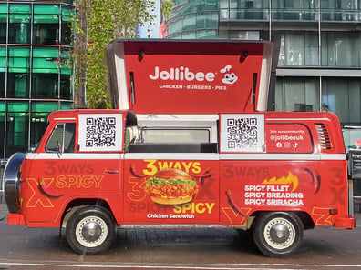 Jollibee's sampling VW Camper van, with the roof open to serve up 30way spicy chicken burgers to students during Freshers Week,
