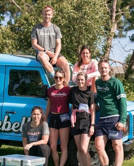 Blue land rover defender barebells and team