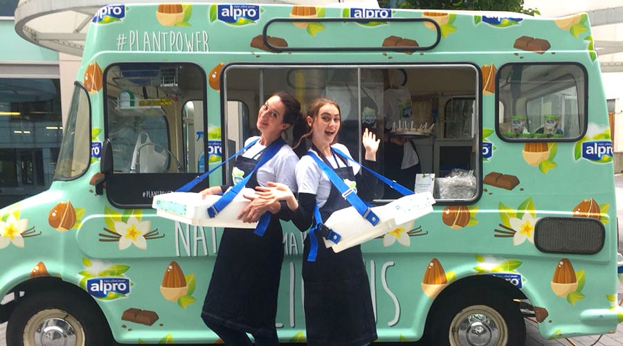 Two staff members cheer for the Alpro ice cream campaign