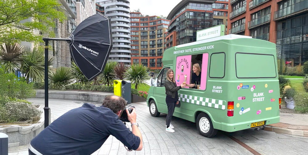 A photographer takes campaign images of the Blank Street ice cream van.