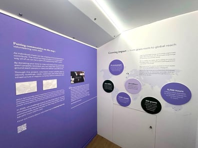 A purple education space inside the ACT mobile exhibition bus.
