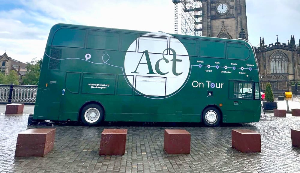 ACT and Ardonagh Group's green double-decker exhibition bus.