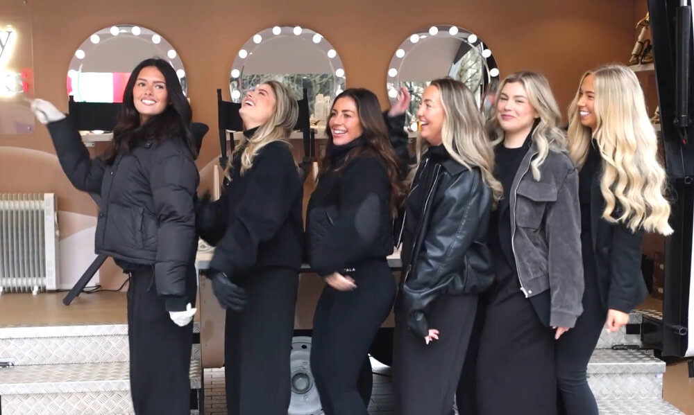 Young women line up and pose for the Beauty Works immersive launch campaign.