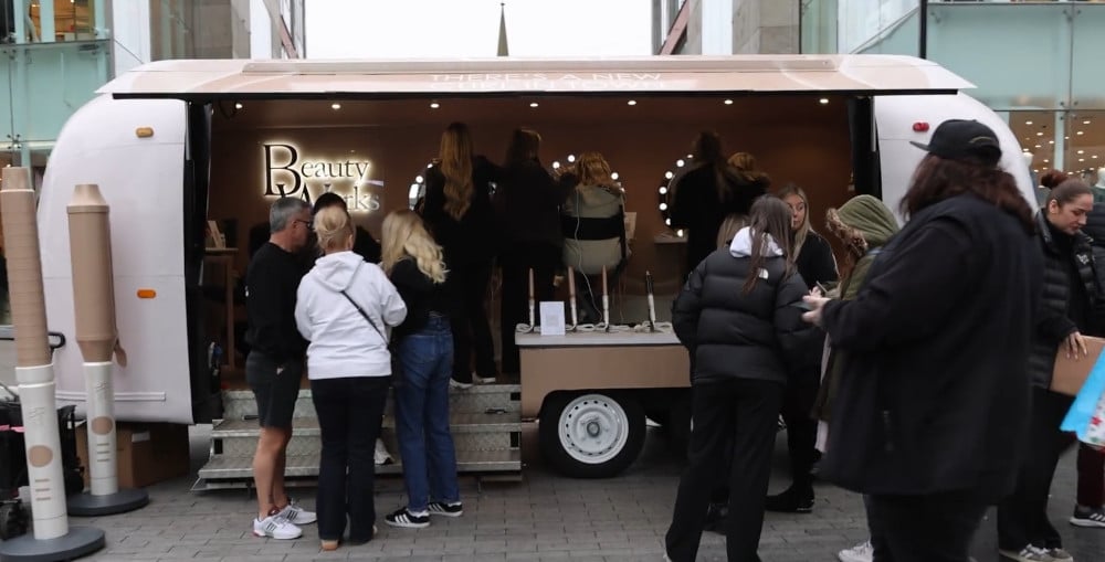 A large crowd at Beauty Works' immersive launch or brand activation.