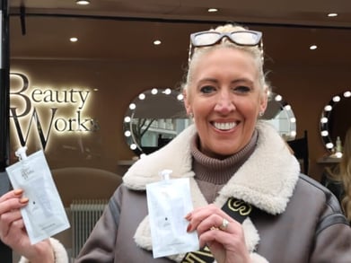 A guest at the Beauty Works launch event poses with gifts.