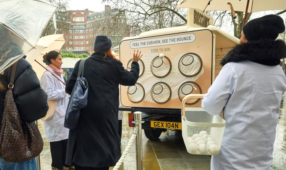 Women play the Biossance game, one of Promohire's gamification ideas.