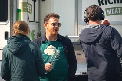 Joe Swash at the Richmond Sausages influencer campaign, in front of an American ambulance as part of a promotion.