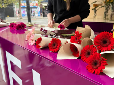 Flowers at a custom counter for SHEIN's 2026 fall/winter fashion marketing pop-up event.