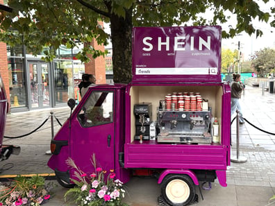 A SHEIN Piaggio Ape coffee van for the FW26 collection pop-up event.