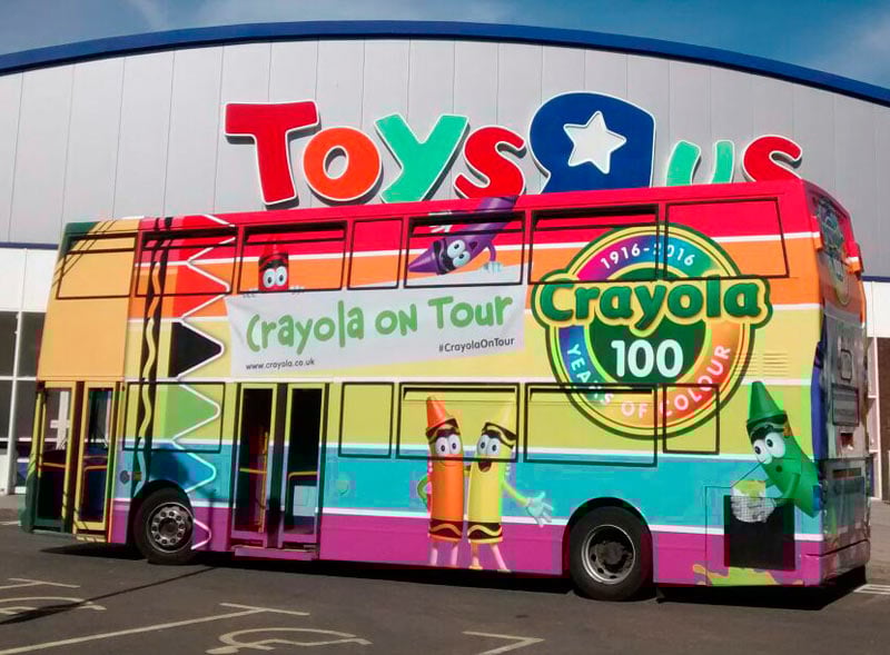 The Crayola bus parked outside Toys R Us as part of a promotional vehicle campaign.