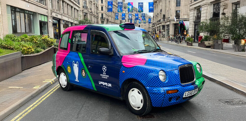 The Champions League taxi in a street as one of 2025's big promotional vehicle trends.