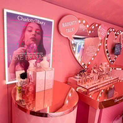 A pink and gold make-up setup for a beauty event.