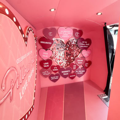 An interior backwall inside Charlotte Tilbury's custom branded Airstream experience.