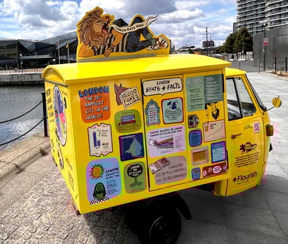A side view of the data vandals live campaign Piaggio Ape, by the River Thames.