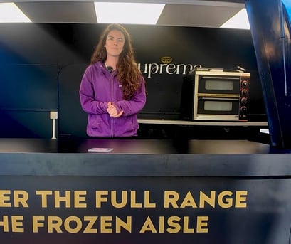 A Promohire staff member, Shani, stood in the Suprema pizza Airstream, next to pizza ovens.