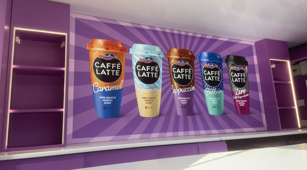 Emmi sampling van lightbox and storage, with images of coffee cups.