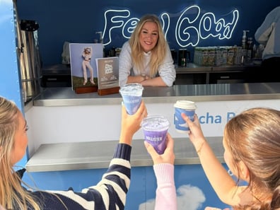 Young women gather with drinks for Hollister's 'feel good' experiential event.