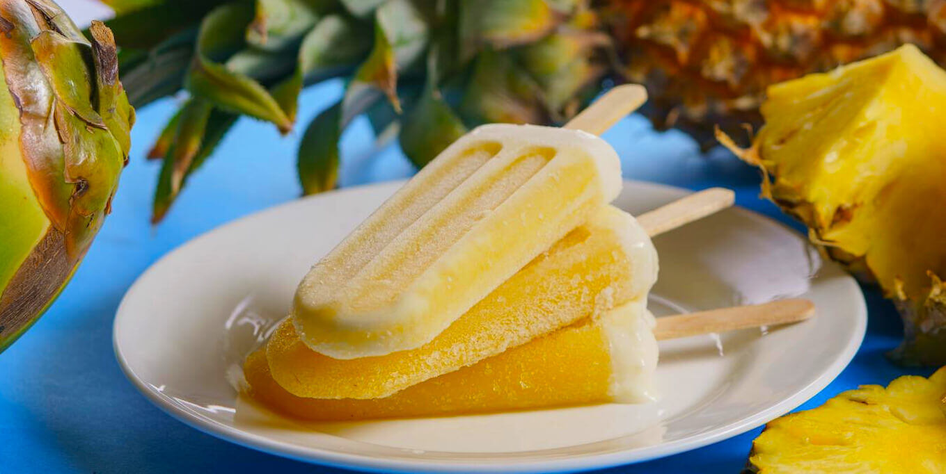Yellow ice lollies on a plate for a promotional campaign