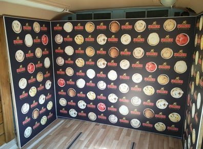 Bus interior for Fuller's Kitchen showing a photo-op wall.