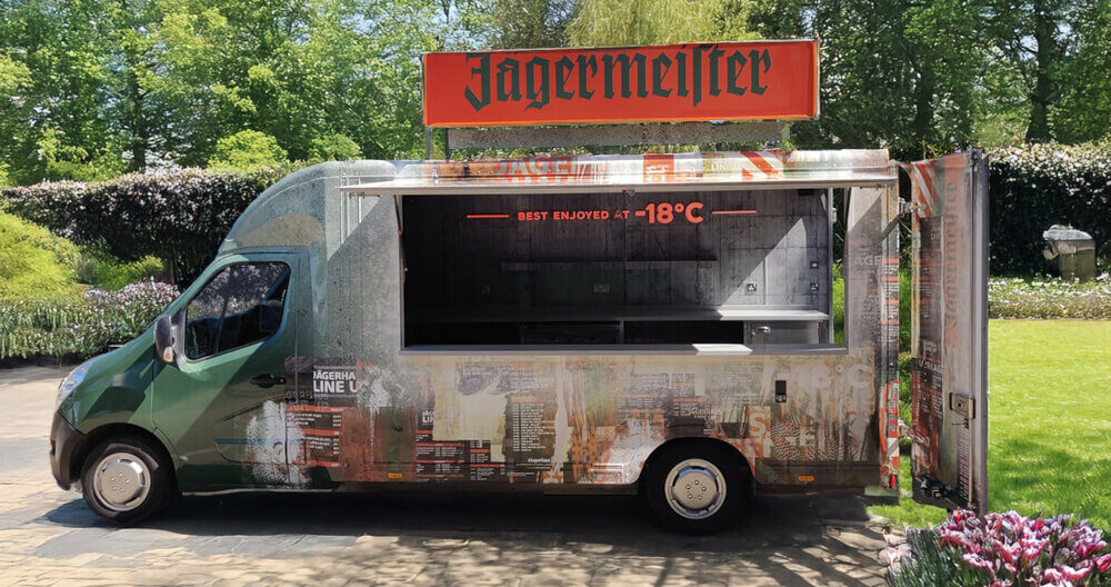 a side view of the Jagermeister modern sampling van
